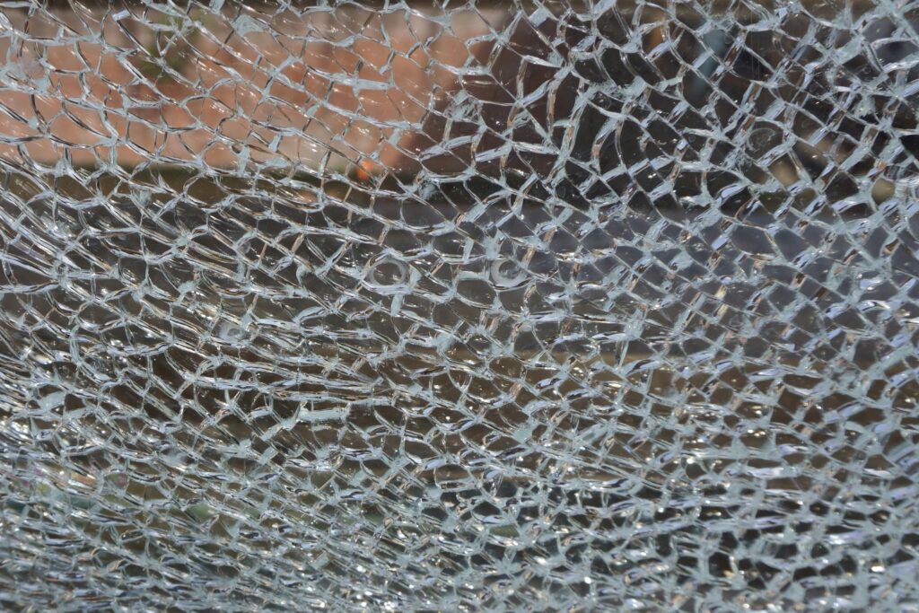 Detailed view of shattered glass pieces creating a textured pattern
